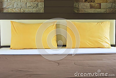 Bed and Pillows with warm glow Stock Photo