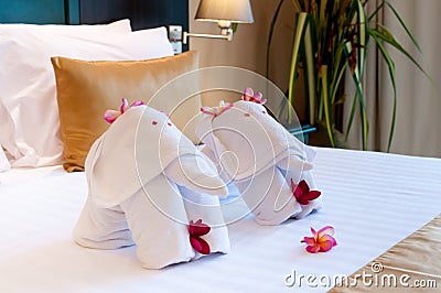 Bedding elephant origami towel on the bed Stock Photo