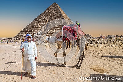 Bedouin man dressed in traditional clothes, in front of the Giza Necropolis pyramids complex. Egypt, Africa Editorial Stock Photo