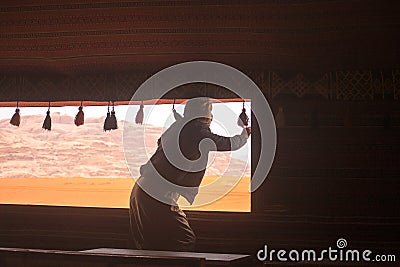 Bedouin open the window of a traditional tent Editorial Stock Photo