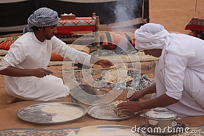 Bedouin Prepare Bread at a Desert Camp in Wahiba Sands in Oman Editorial Stock Photo