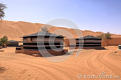 Bedouin style camping beside a huge sand dune at the Wahiba Sands desert, Oman Stock Photo