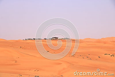 Bedouin style camping beside a huge sand dune at the Wahiba Sands desert, Oman Stock Photo