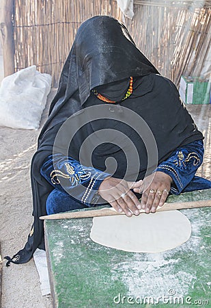 Bedouin woman making traditional bread Stock Photo