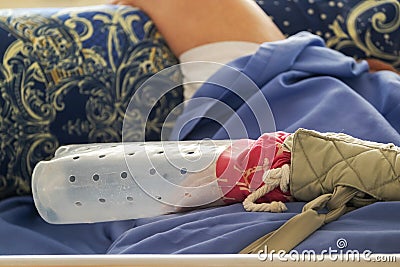 Bedridden Patient with a Scratching Protection on his Hand Stock Photo