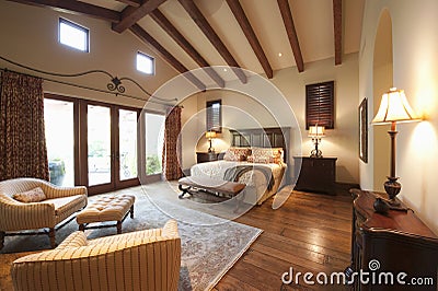 Bedroom With Beamed Wooden Ceiling Stock Photo