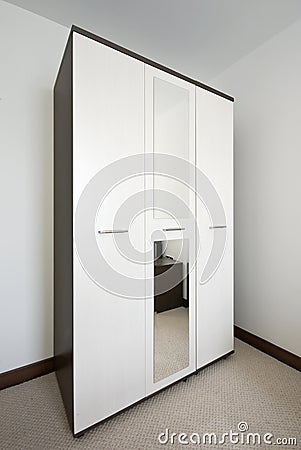 Bedroom with a big white wardrobe Stock Photo