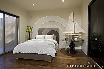 Bedroom With Boat Model On Side Table Stock Photo