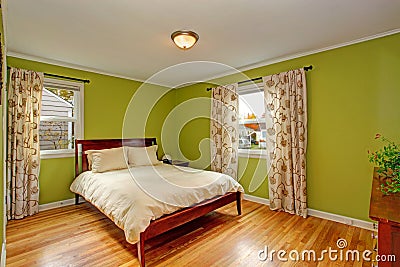 Bedroom with bright neon green walls Stock Photo
