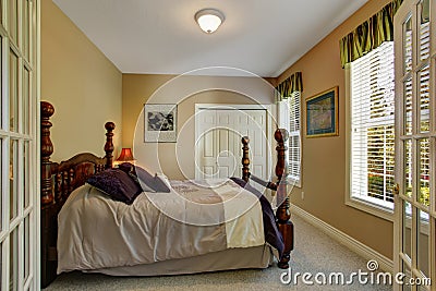 Bedroom with carved wood bed Stock Photo