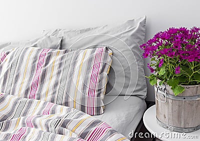 Bedroom decorated with bright purple flowers Stock Photo