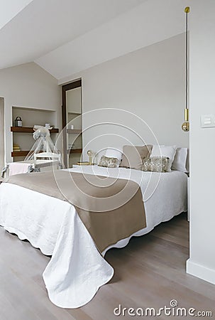 Bedroom with double bed and cot Stock Photo