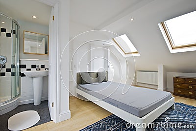 Bedroom with en suite bathroom Stock Photo
