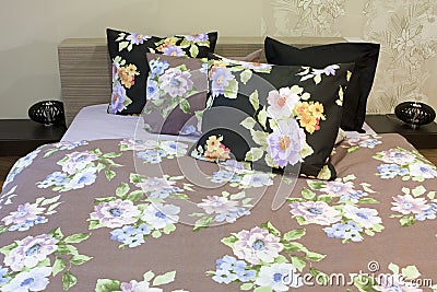 Bedroom with floral bedlinen Stock Photo