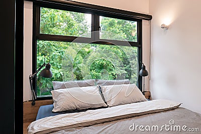 Bedroom with fresh nature green tree view Stock Photo