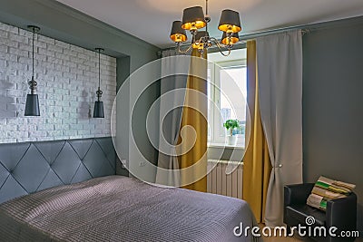 Bedroom in gray and yellow tones Stock Photo