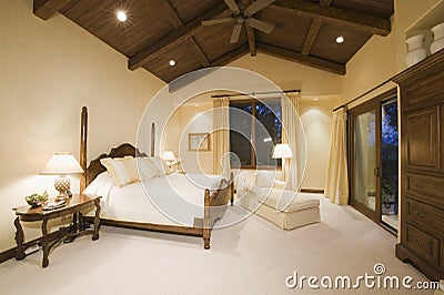 Bedroom With High Wooden Ceiling Stock Photo