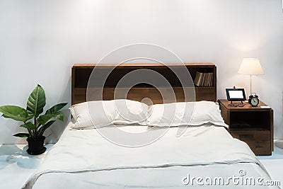 Bedroom interior with bed and pillow of cosy home in modern design. Vintage bedroom. Stock Photo