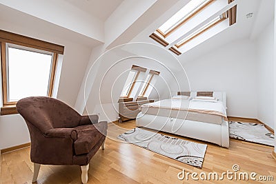 Bedroom interior in luxury loft, attic, apartment with roof wind Stock Photo