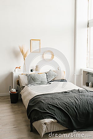 Bedroom interior in a Scandinavian minimalist style in white and gray colors Stock Photo