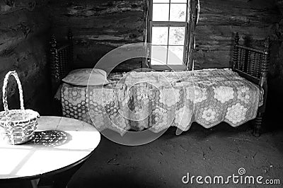 Bedroom of Old Pioneer Log Cabin Stock Photo