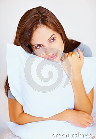 Bedroom, pillow and woman with peace, thinking and calm with freedom, morning and daydreaming. Person, girl and lady Stock Photo