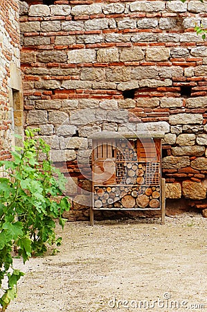 Bee hotel at medieval chateau Stock Photo