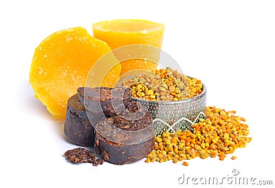 Bee pollen baskets with Propolis or bee glue and with Beeswax. Isolated on white background Stock Photo