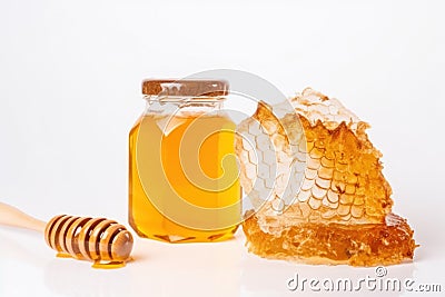 A bee sits on a honeycomb - a jar of honey white background Stock Photo