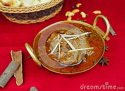 Beef Bhuna korma masala rogan gosht with bread served in karahi isolated on table top view of indian, pakistani and punjabi spicy Stock Photo