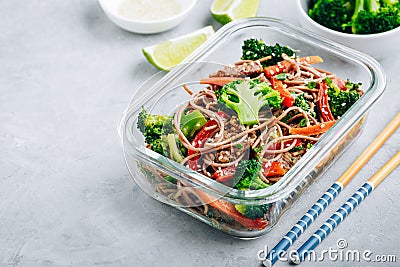 Beef broccoli noodles stir fry meal prep lunch box container Stock Photo