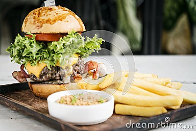 Beef burger with fries and mustard sauce set meal Stock Photo