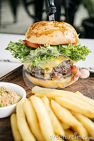 Beef burger with fries and mustard sauce set meal Stock Photo