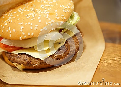 Beef burger on wood table, close-up image, focus on the beef Stock Photo