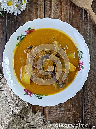 beef curry on a floral bowl served during eid or iftar ramadan Stock Photo