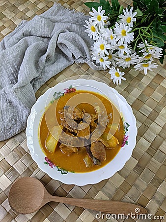 beef curry on a floral bowl served during eid or iftar ramadan Stock Photo