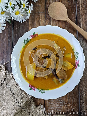 beef curry on a floral bowl served during eid or iftar ramadan Stock Photo