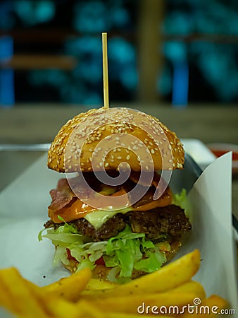 Beef grill bacon cheese with salad hamberger and French fries Stock Photo