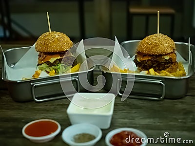 Beef grill bacon cheese with salad hamberger and French fries Stock Photo