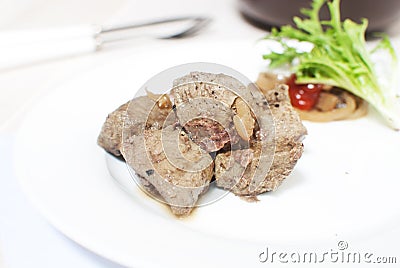 Beef liver pieces with onions Stock Photo