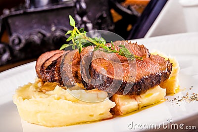 Beef with mashed potatoes on white plate Stock Photo