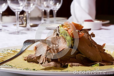 Beef meat with tomatoes and greens on a plate Stock Photo