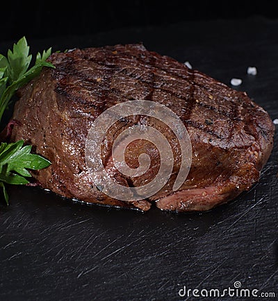 Beef medallion steak on a black background Stock Photo