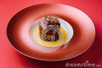 Beef medallion steak on red plate Stock Photo