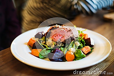 Beef salad with quinoa and baked vegetables Stock Photo