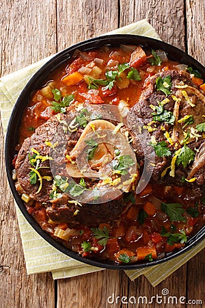 Beef shank Ossobuco alla Milanese with gremolata and spicy sauce Stock Photo