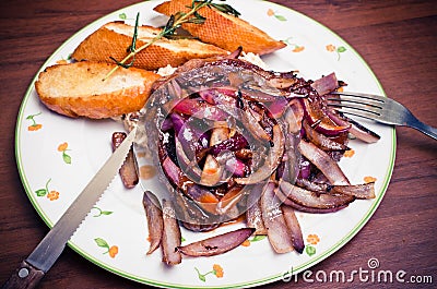 Beef steak with red onion Stock Photo