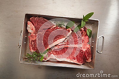 Beef steak t-bone with vintage meat fork Stock Photo