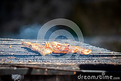 Beef steaks on the grill with smoke Stock Photo