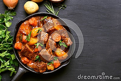 Beef stew with potatoes, carrots and herbs Stock Photo